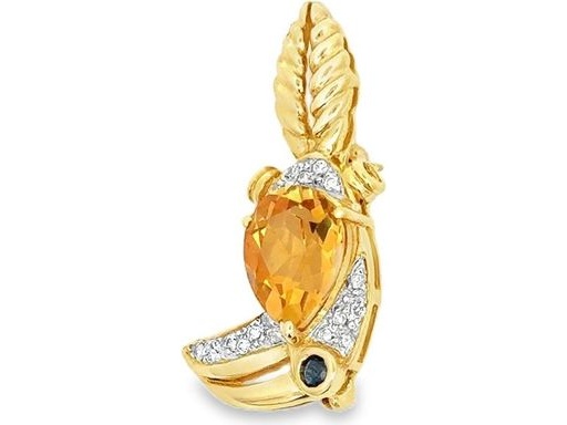 Toucan motif brooch in 18k yellow gold ,featuring a pear  yellow citrin,saphire and diamond accents