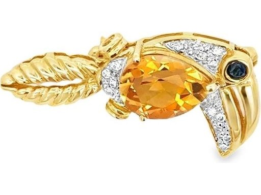 Toucan motif brooch in 18k yellow gold ,featuring a pear  yellow citrin,saphire and diamond accents
